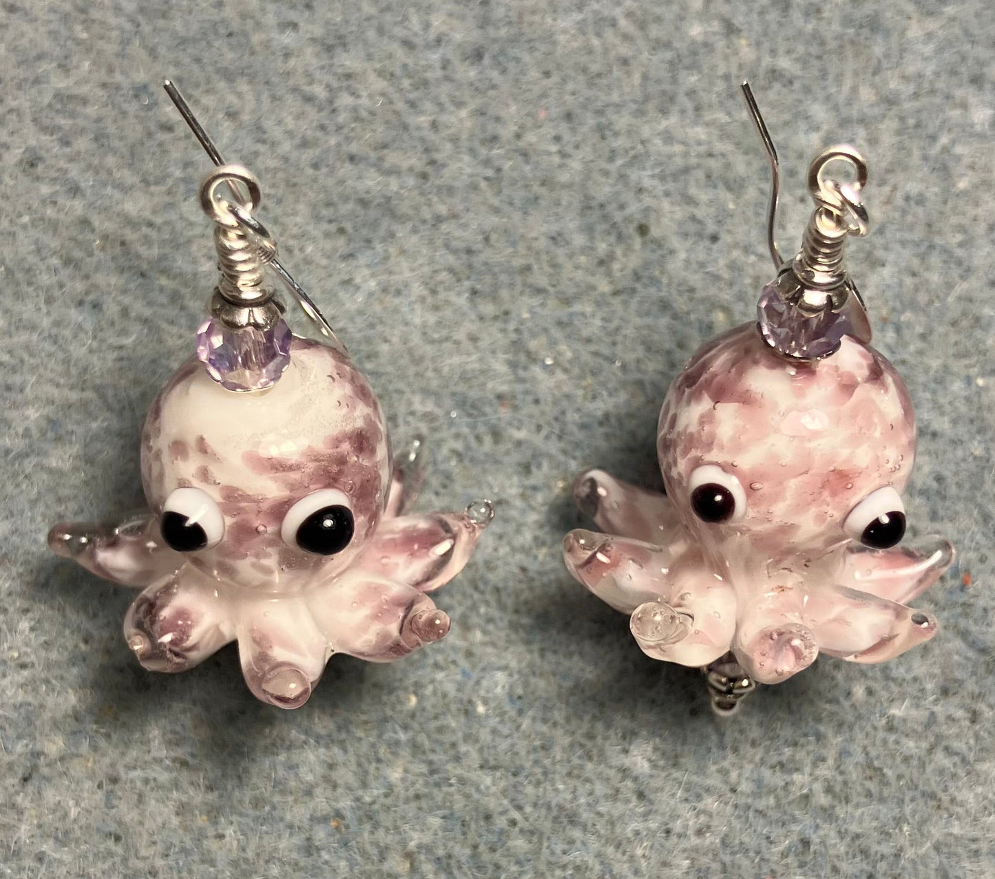 Light violet and white mottled lamp work octopus bead earrings adorned with light violet Chinese crystal beads.