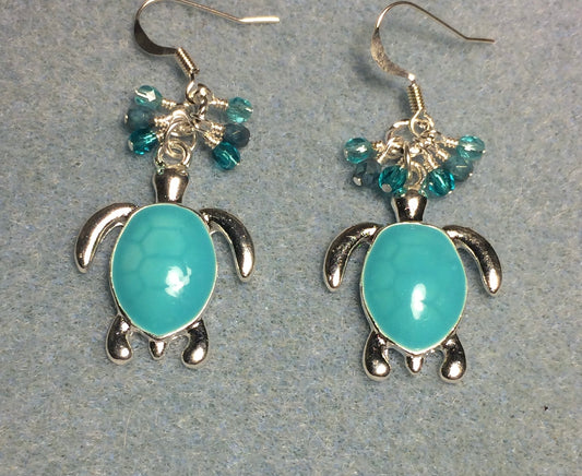 Silver and turquoise enamel sea turtle charm earrings adorned with tiny dangling turquoise Czech glass beads.