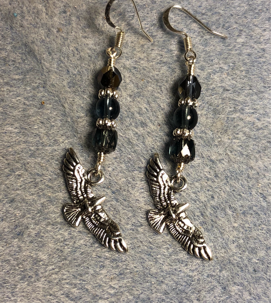 Silver flying eagle charm earrings adorned with Montana blue Czech glass beads
