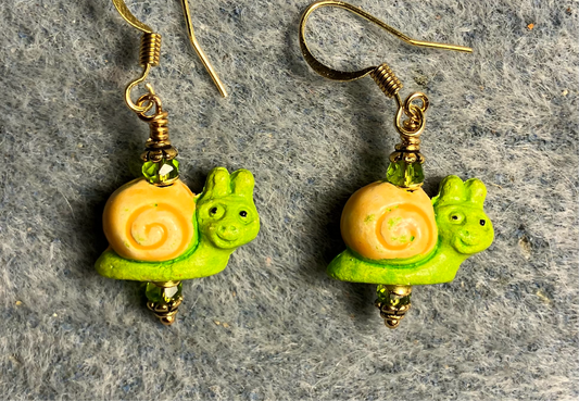 Small lime green and yellow ceramic snail bead earrings adorned with lime green Chinese crystal beads.