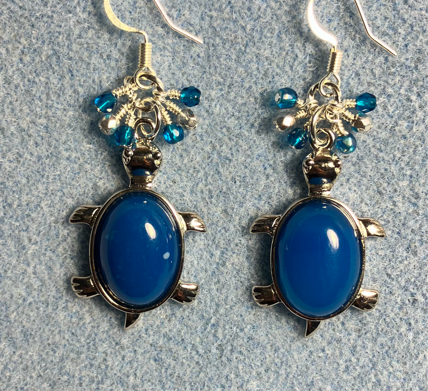 Large silver and blue agate gemstone turtle charm earrings adorned with small dangling turquoise and silver Czech glass beads.