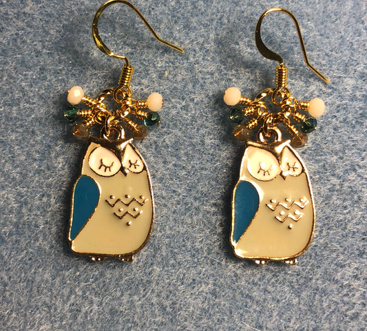 Tan, turquoise, and white enamel sleepy owl charm earrings adorned with tiny dangling tan, turquoise, and white Chinese crystal beads.
