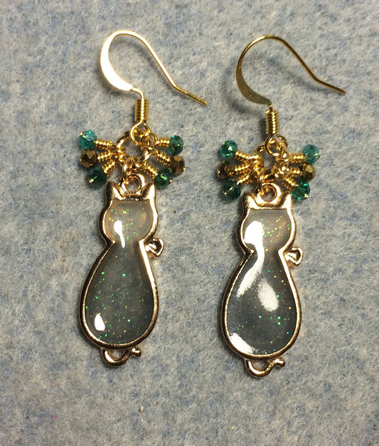 Teal gray and gold sparkly resin cat charm earrings adorned with small dangling teal and gold Chinese crystal beads.