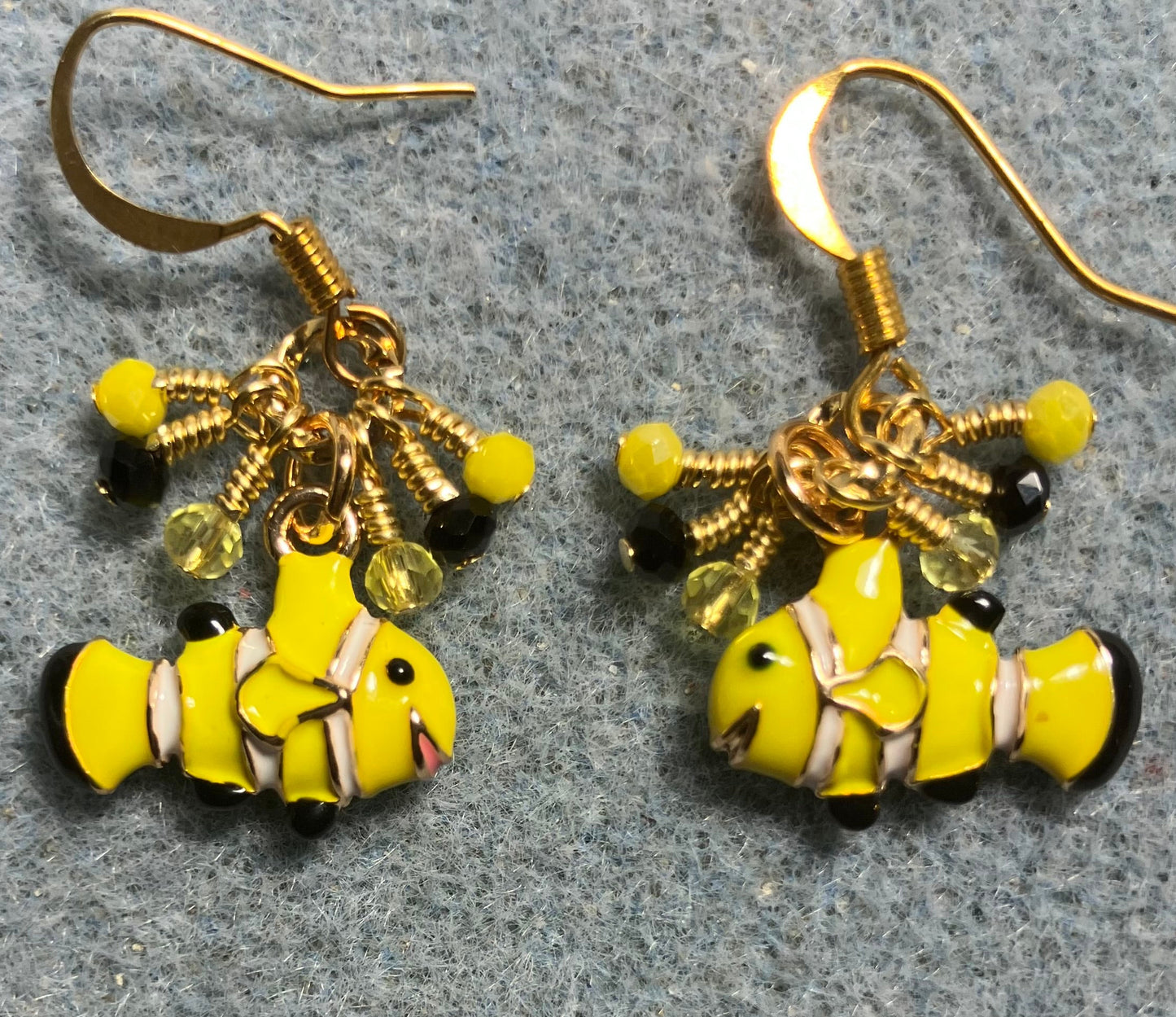 Small yellow and black enamel striped fish charm earrings adorned with tiny dangling yellow and black Chinese crystal beads.