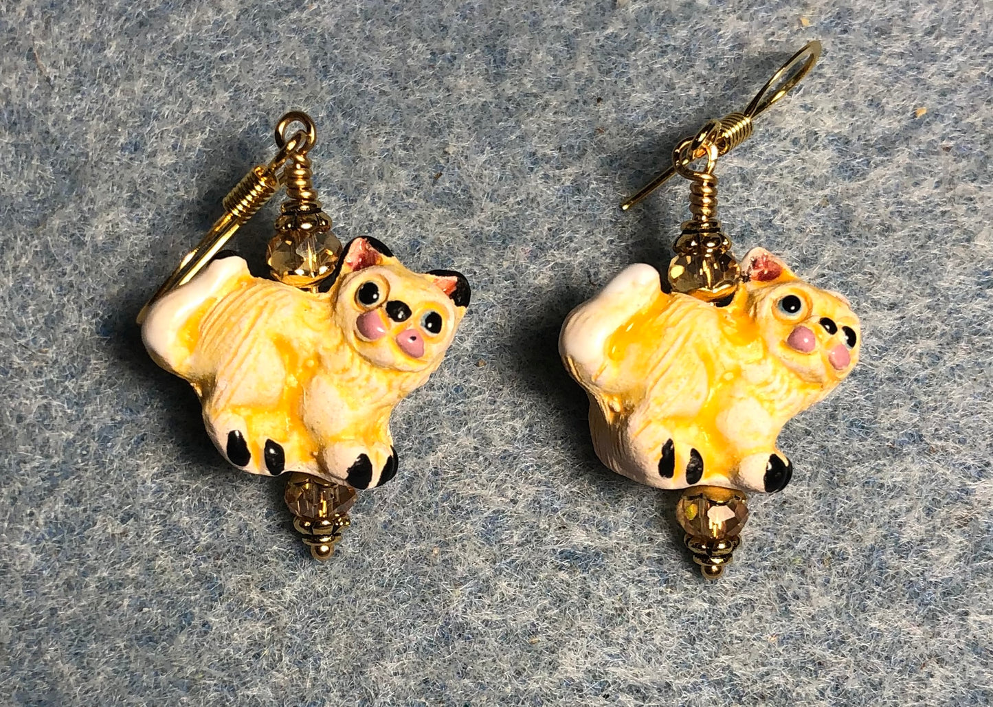 Small amber yellow ceramic tabby cat bead earrings adorned with amber Chinese crystal beads.