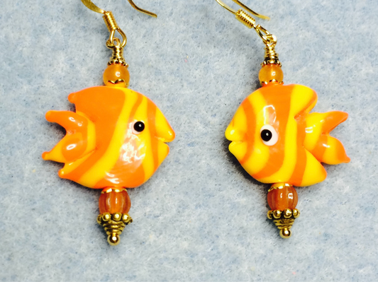 Orange and yellow lamp work striped angelfish bead earrings adorned with orange Czech glass beads.