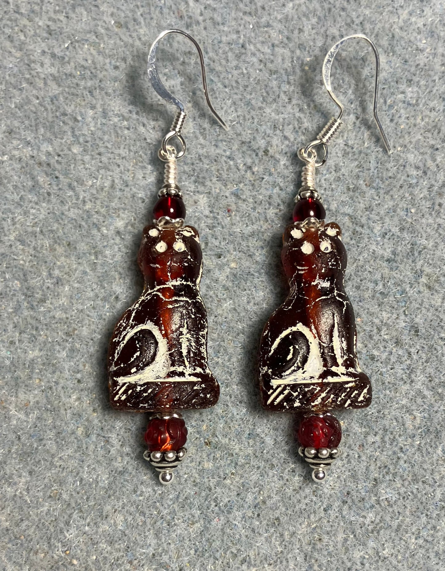 Dark red (with white inlay) fancy Czech glass cat bead earrings adorned with dark red Czech glass beads.