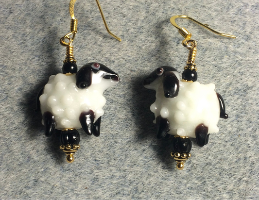 White and black lamp work sheep bead earrings adorned with black Czech glass beads.