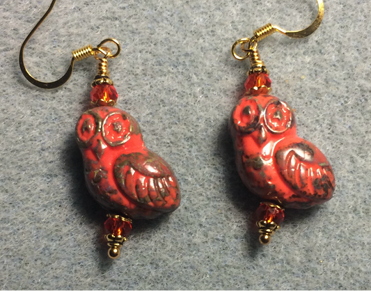 Red and brown fancy Czech glass owl bead earrings adorned with red Chinese crystal beads.