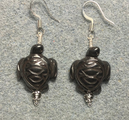 Hematite gemstone sea turtle bead earrings adorned with gray Chinese crystal beads.