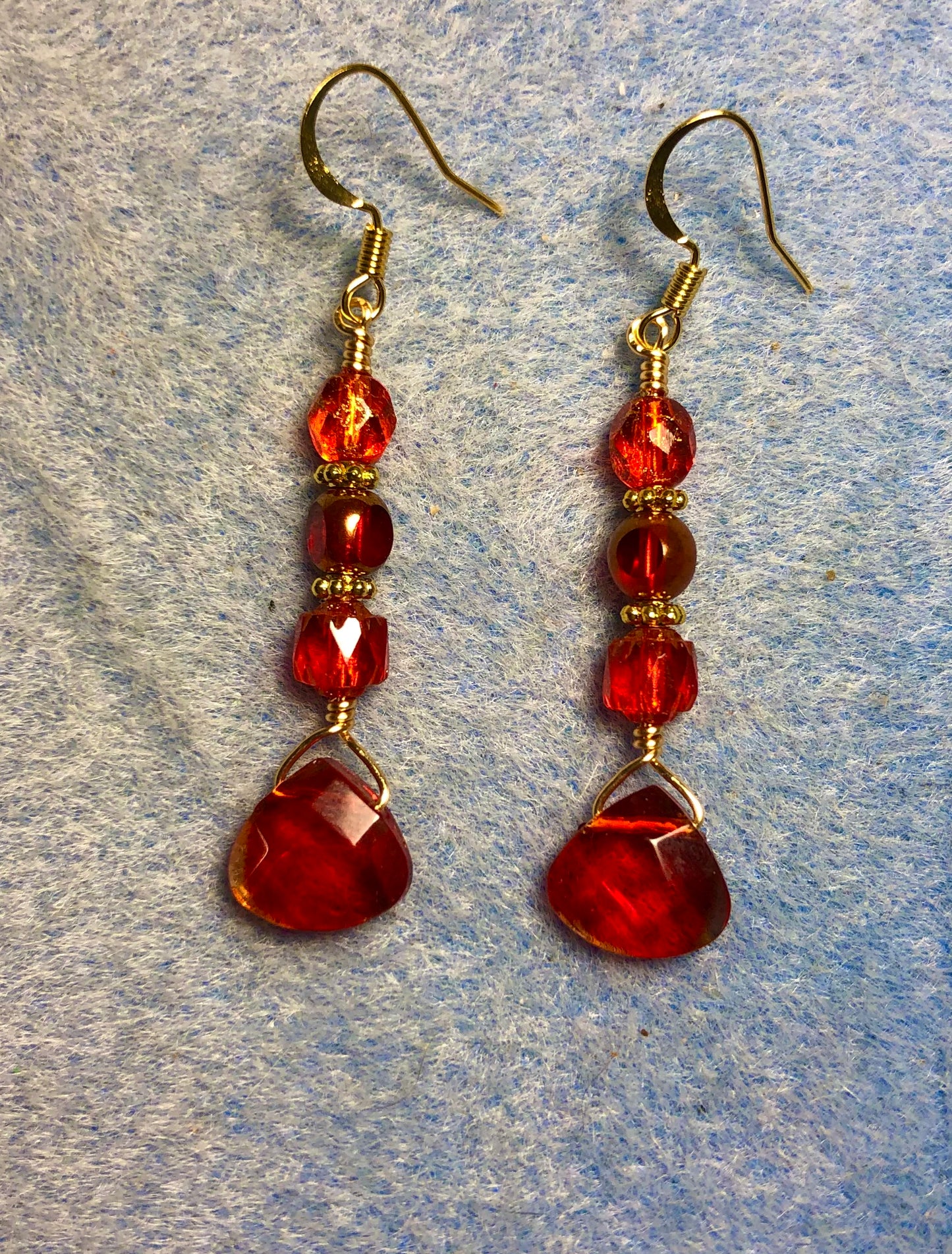 Bright red Czech glass briolette bead earrings adorned with red Czech glass beads.