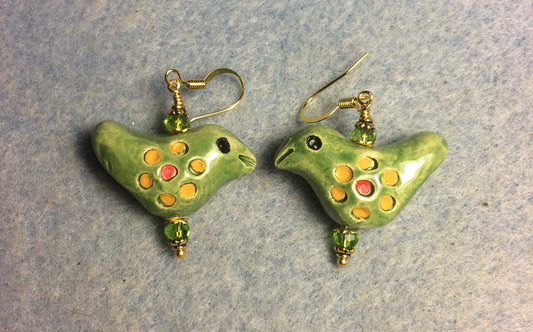 Medium olive green, yellow, and red ceramic songbird bead earrings adorned with olive green Chinese crystal beads.
