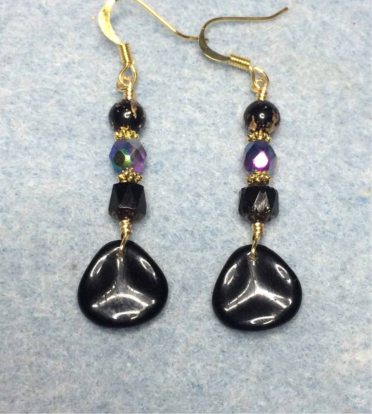 Black and purple Czech glass rose petal earrings adorned with black and purple Czech glass beads.