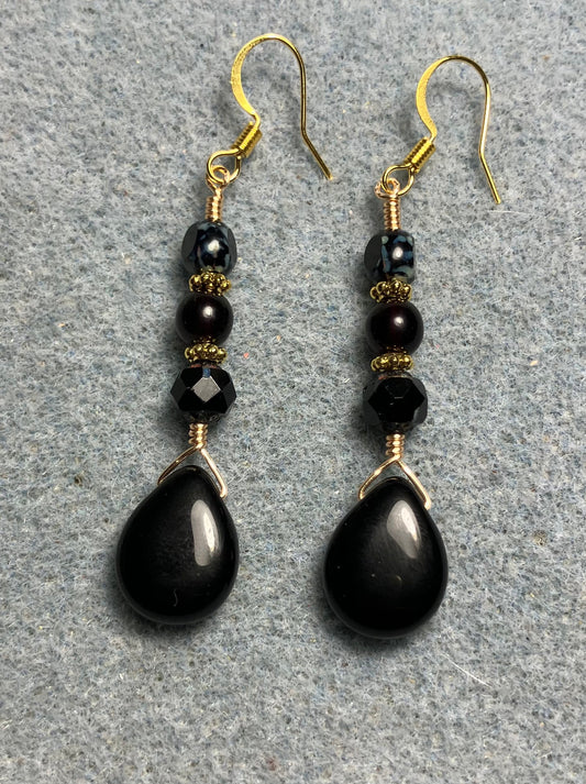 Black Czech glass pear drop bead earrings adorned with black Czech glass beads.
