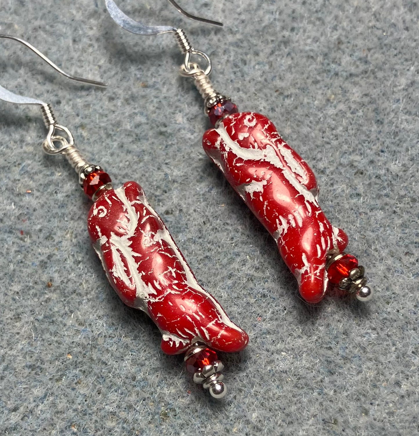 Small red (with white inlay) Czech glass bunny rabbit bead earrings adorned with red Chinese crystal beads.