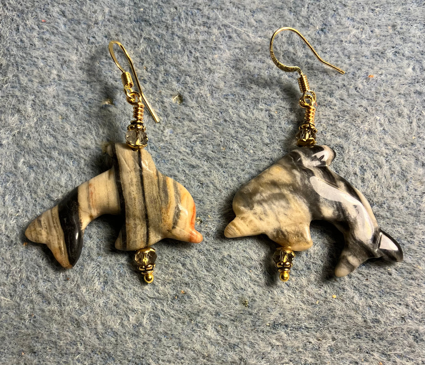 Gray and black zebra jasper gemstone dolphin bead earrings adorned with gray Chinese crystal beads.