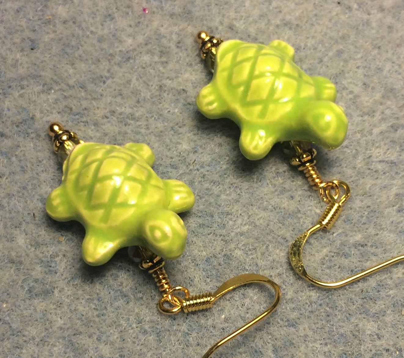 Lime green ceramic turtle bead earrings adorned with lime green Chinese crystal beads.