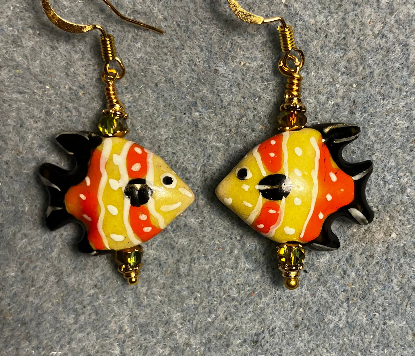 Orange, olive green, and black ceramic angelfish bead earrings adorned with sparkly olive green Chinese crystal beads.