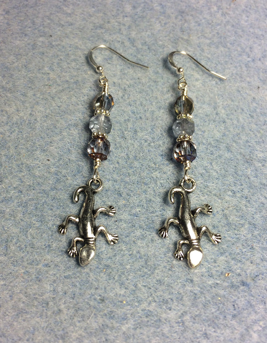 Silver lizard charm earrings adorned with light blue Czech glass beads