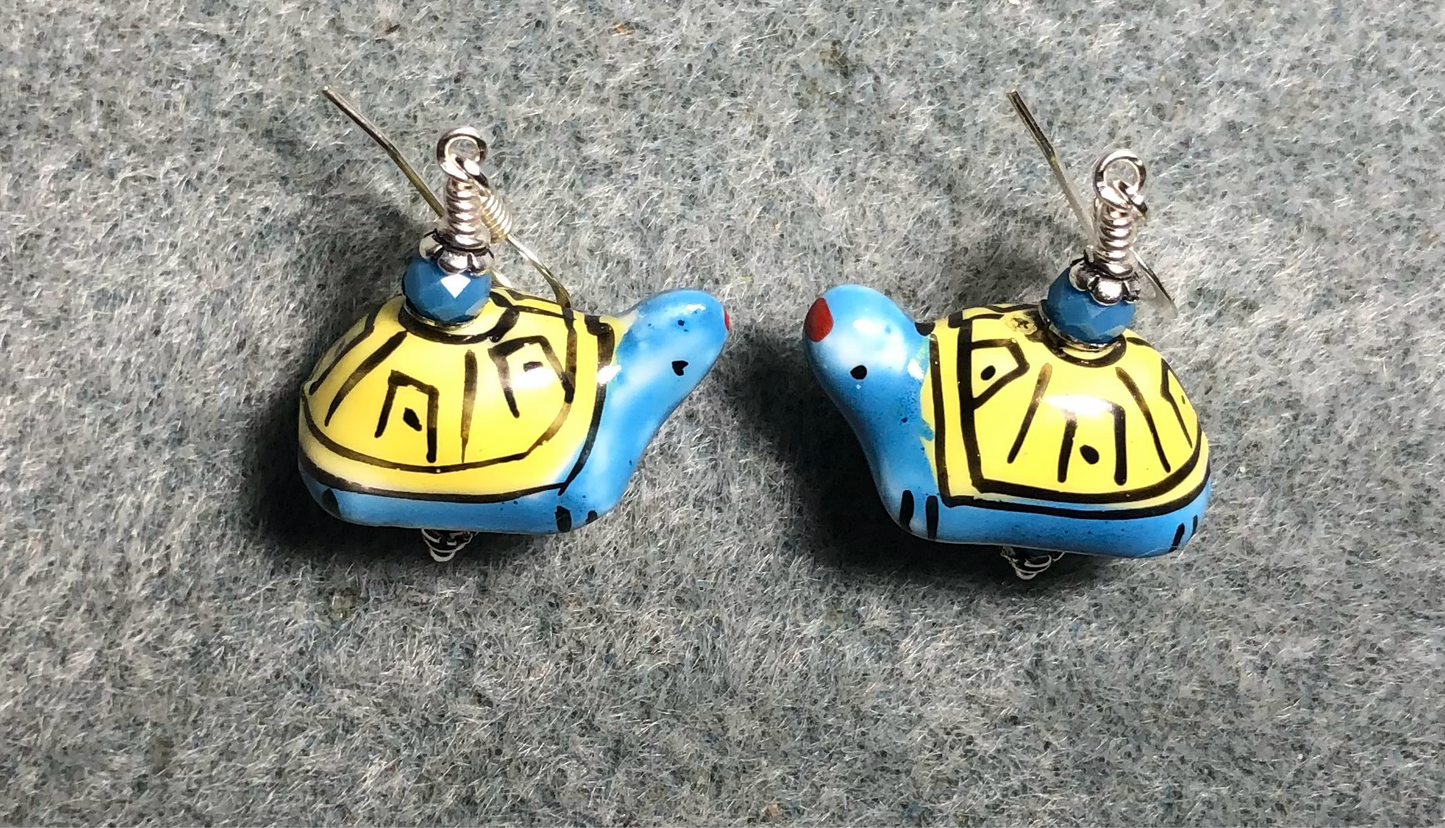 Blue and yellow ceramic turtle bead earrings adorned with blue Chinese crystal beads.