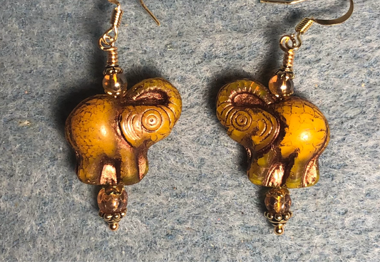 Amber (with brown inlay) Czech glass elephant bead earrings adorned with amber Czech glass beads.