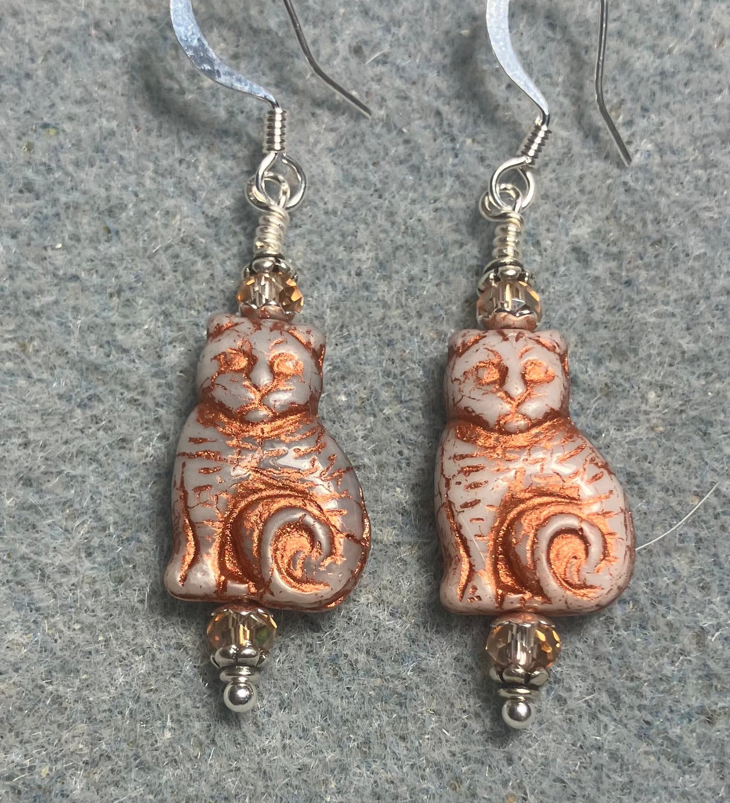 Medium beige (with copper inlay) Czech glass cat bead earrings adorned with peach copper Chinese crystal beads.