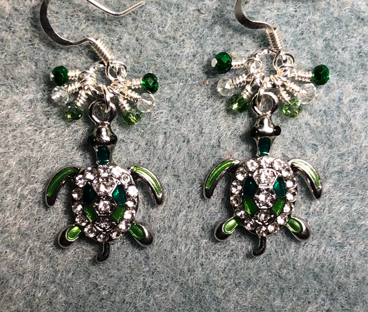 Silver and green enamel and clear rhinestone turtle charm earrings adorned with tiny dangling dark green, silver, and green Chinese crystal beads.