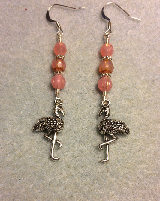Silver flamingo charm earrings adorned with milky pink Czech glass beads