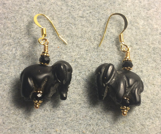 Black onyx gemstone elephant bead earrings adorned with black Chinese crystal beads.