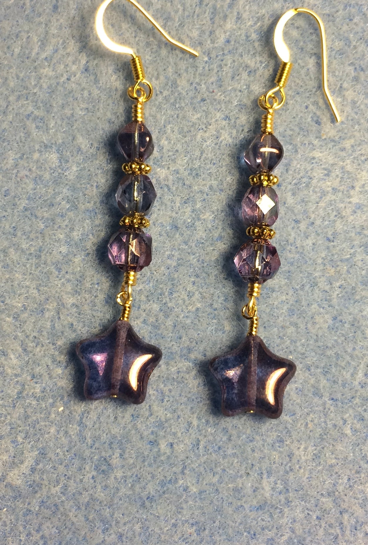 Small purple Czech glass star bead earrings adorned with purple Czech glass beads.