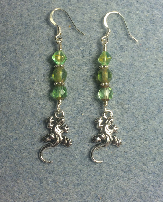 Small silver lizard charm earrings adorned with light green Czech glass beads