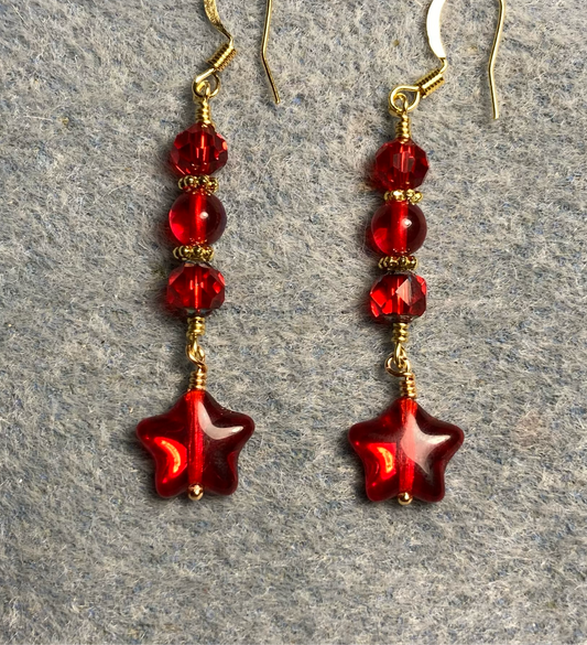 Small translucent red Czech glass star bead earrings adorned with red Czech glass beads.