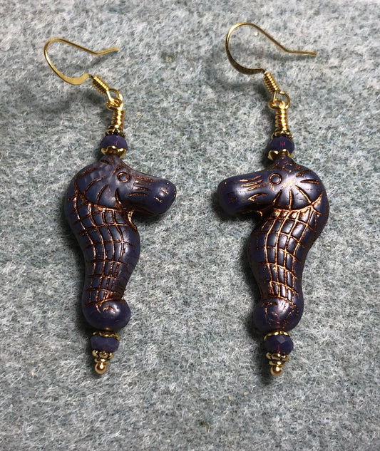Purple (with copper inlay) Czech glass seahorse bead earrings adorned with purple Chinese crystal beads.