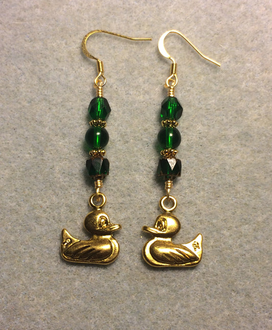 Gold duck charm earrings adorned with emerald green Czech glass beads