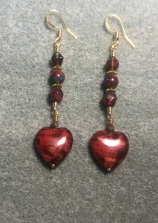 Dark red Picasso Czech glass heart bead earrings adorned with dark red Picasso Czech glass beads.