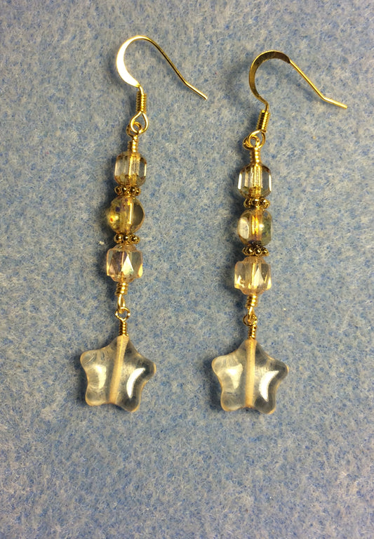 Small translucent yellow Czech glass star bead earrings adorned with yellowish clear Czech glass beads.