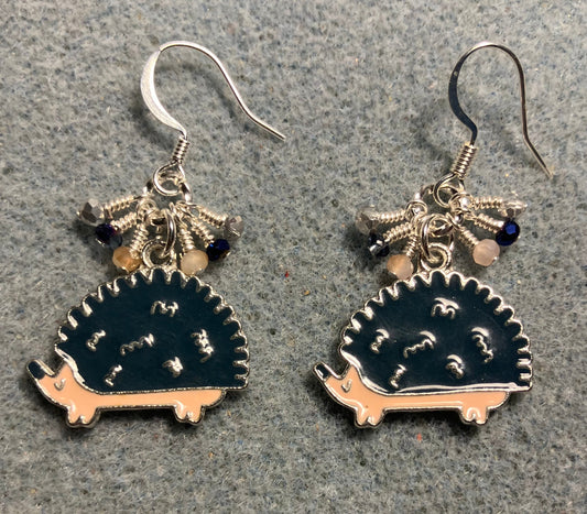 Dark blue and beige enamel hedgehog charm earrings adorned with tiny dangling dark blue, beige, and silver Chinese crystal beads.