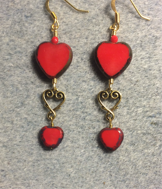 Large and small matching opaque red Czech glass heart bead earrings joined by gold Tierracast heart connectors.