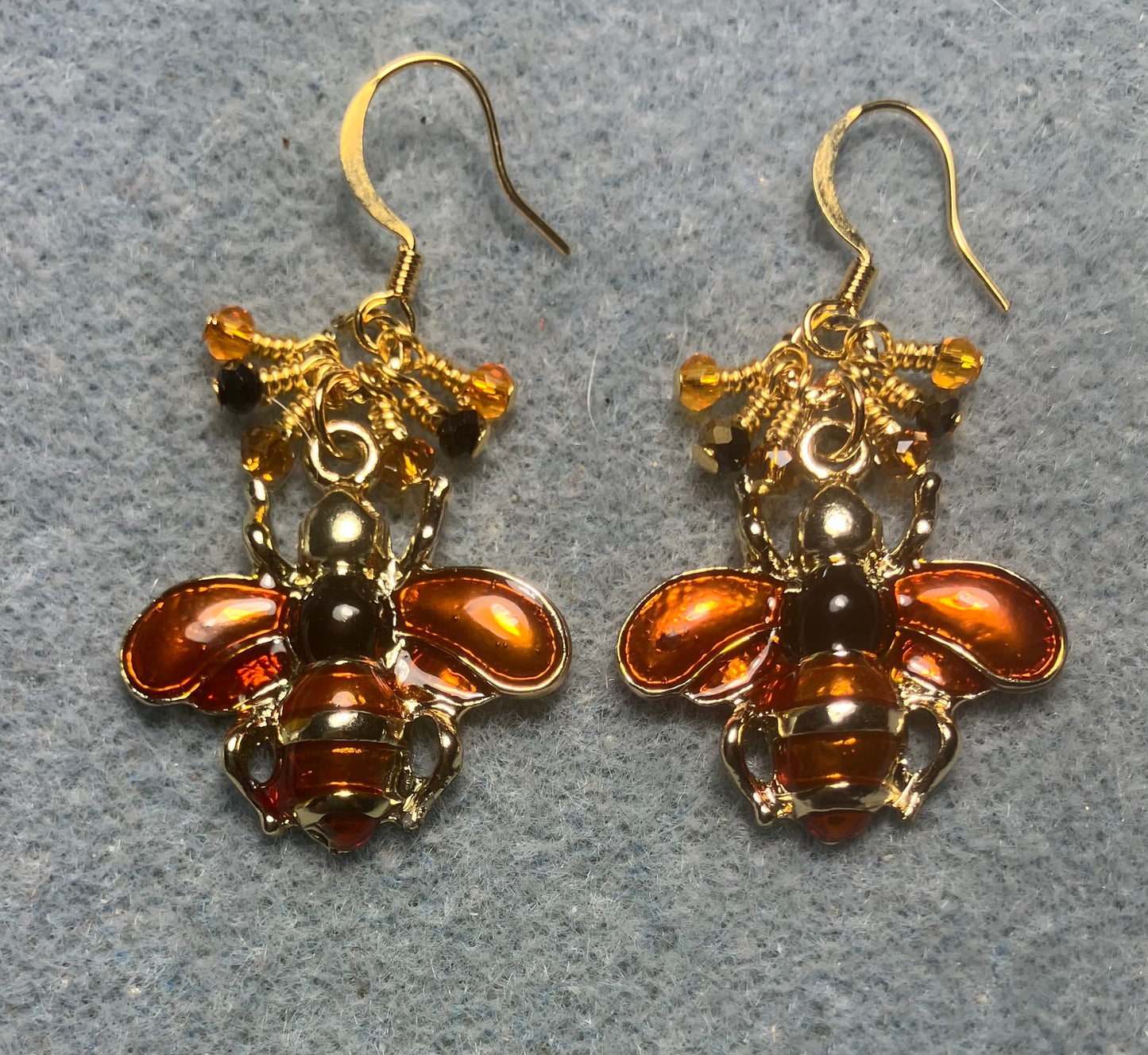 Orange and black enamel honeybee charm earrings adorned with tiny dangling orange and black Chinese crystal beads.
