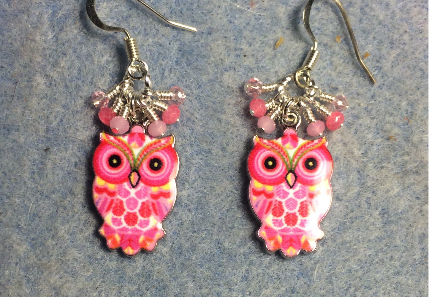 Pink and silver enamel owl charm earrings adorned with tiny dangling hot pink and light pink Chinese crystal beads.