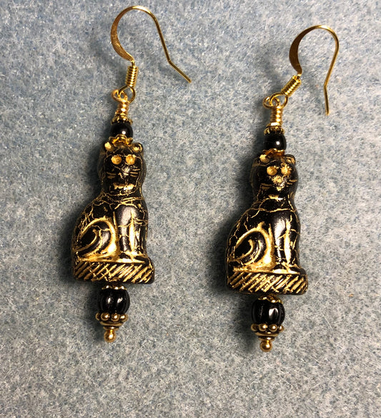Black (with gold inlay) fancy Czech glass cat bead earrings adorned with black Czech glass beads.