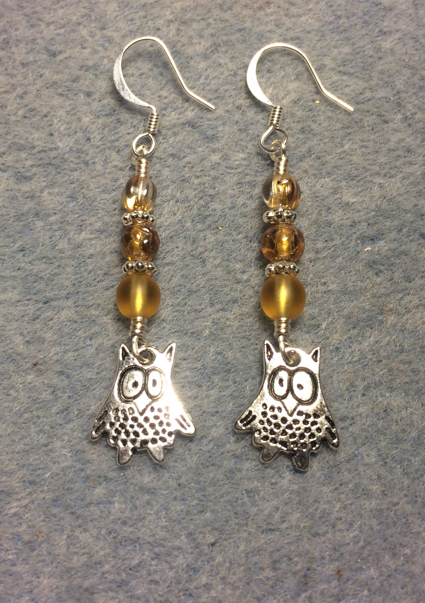 Silver silly owl charm earrings adorned with amber Czech glass beads