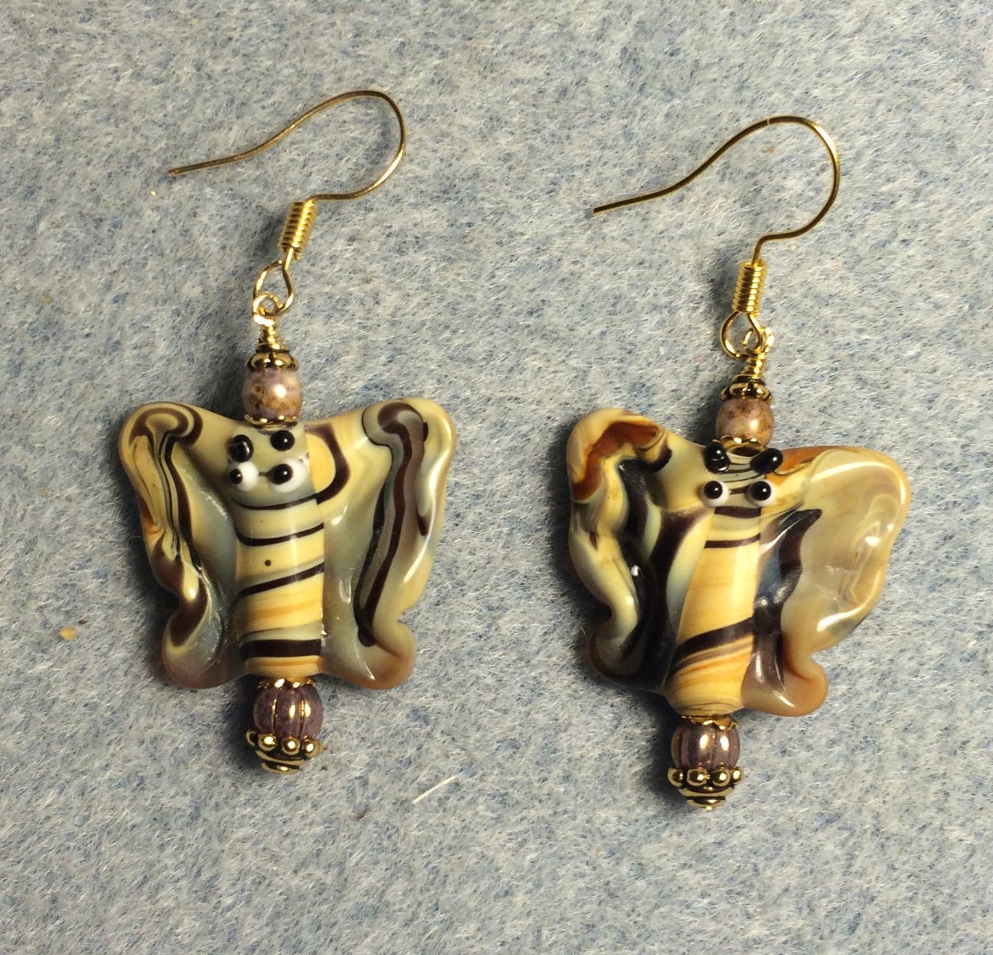 Taffy swirl lamp work butterfly bead earrings adorned with tan Czech glass beads.