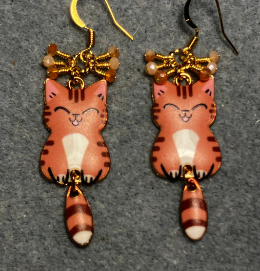 Orange, brown, and white enamel tabby cat charm earrings adorned with tiny dangling orange and white Chinese crystal beads.