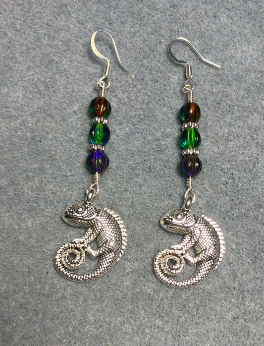 Large silver chameleon charm earrings adorned with green, purple green, and orange green Czech glass melon beads.