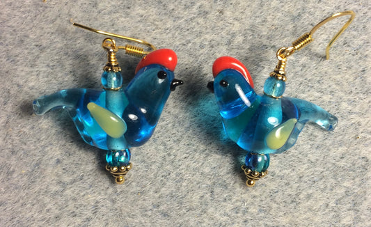 Translucent turquoise and yellow lamp work songbird bead earrings adorned with turquoise Czech glass beads.
