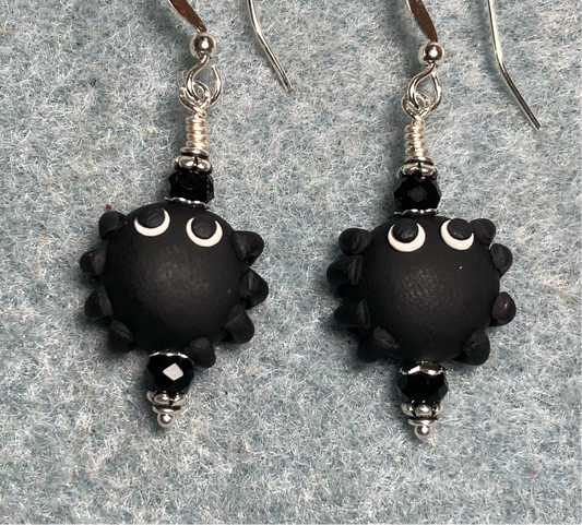 Black polymer clay spider bead earrings adorned with black Chinese crystal beads.