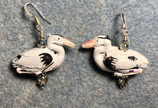 Gray ceramic heron bead earrings adorned with clear Czech glass beads.