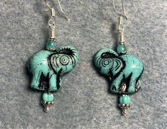 Turquoise (with black inlay) Czech glass elephant bead earrings adorned with turquoise Czech glass beads.