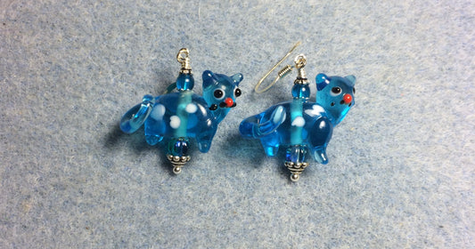 Translucent turquoise lamp work spotted cat bead earrings adorned with turquoise Czech glass beads.